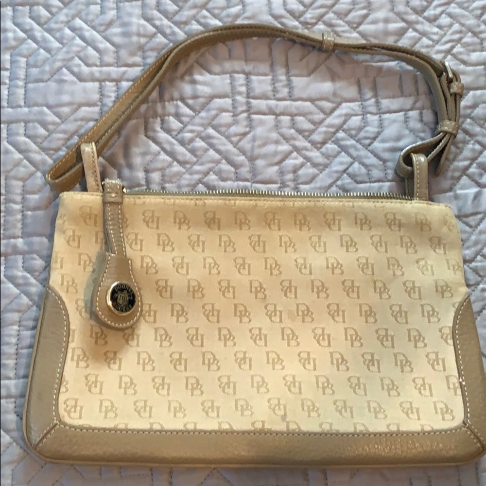 Dooney  and Bourke  beautiful tan clutch bag